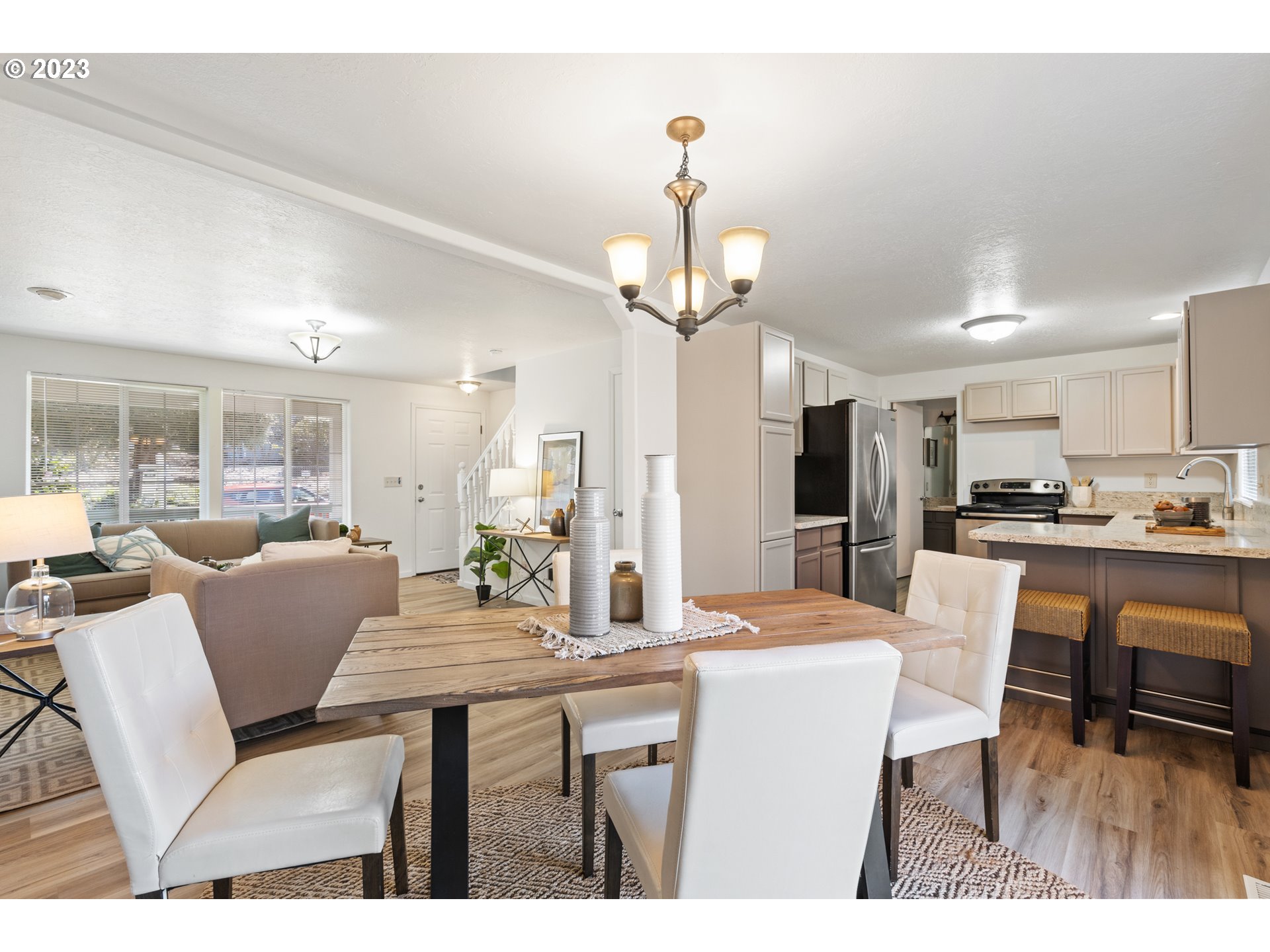 4525 North Colonial Avenue Portland, OR 97217 - Photo 13 of 35 a dining room with kitchen island a dining table and chairs