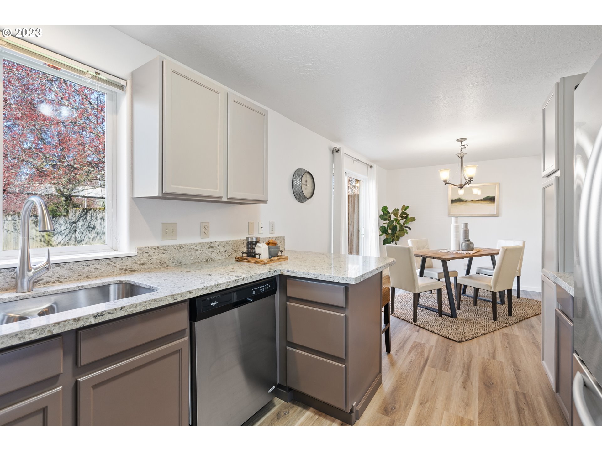 4525 North Colonial Avenue Portland, OR 97217 - Photo 14 of 35 a kitchen with a sink cabinets and dining table