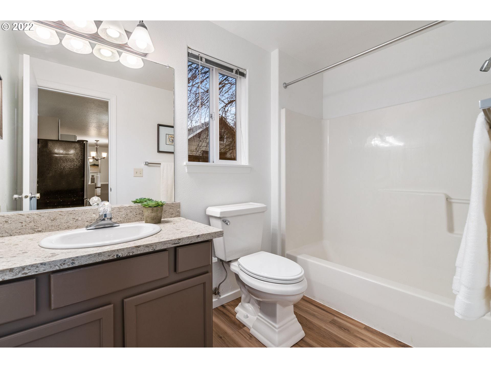 4525 North Colonial Avenue Portland, OR 97217 - Photo 15 of 35 a bathroom with a sink a toilet a mirror and shower