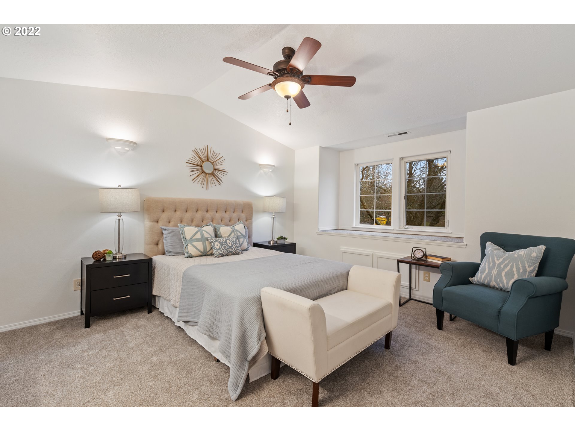 4525 North Colonial Avenue Portland, OR 97217 - Photo 17 of 35 a spacious bedroom with a bed a couch and a couch
