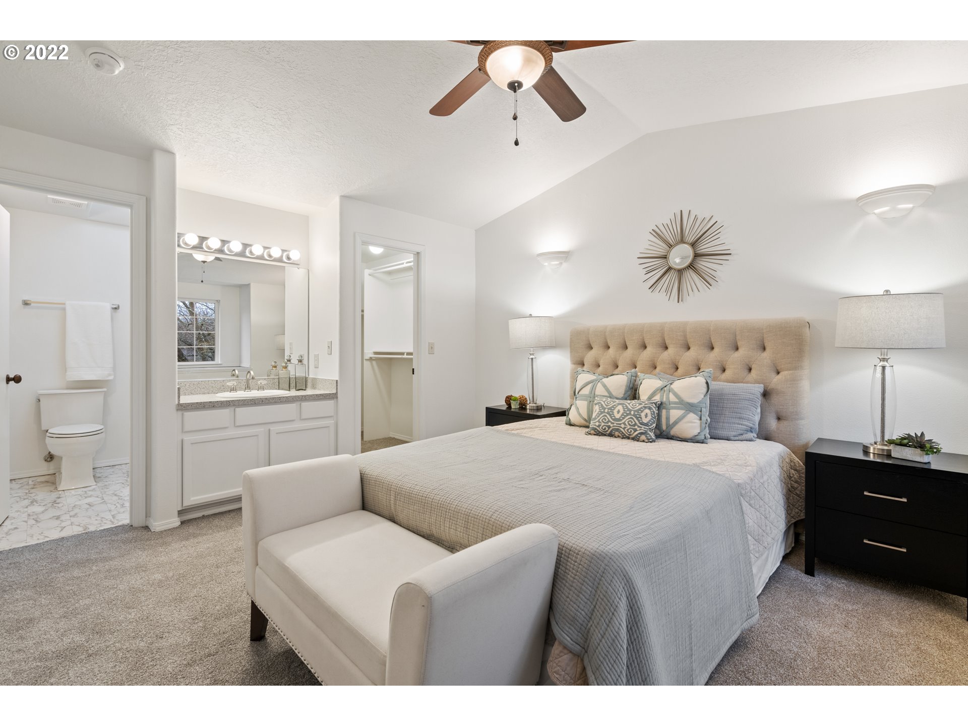 4525 North Colonial Avenue Portland, OR 97217 - Photo 18 of 35 a bedroom with a bed a chandelier and couch