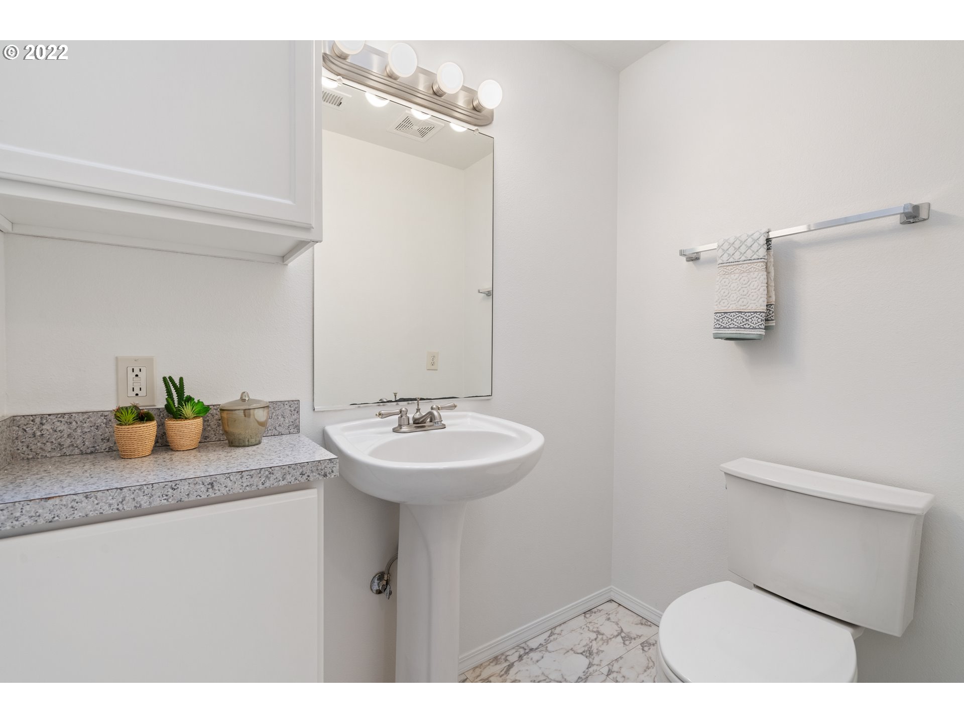 4525 North Colonial Avenue Portland, OR 97217 - Photo 20 of 35 a bathroom with a sink a toilet and mirror