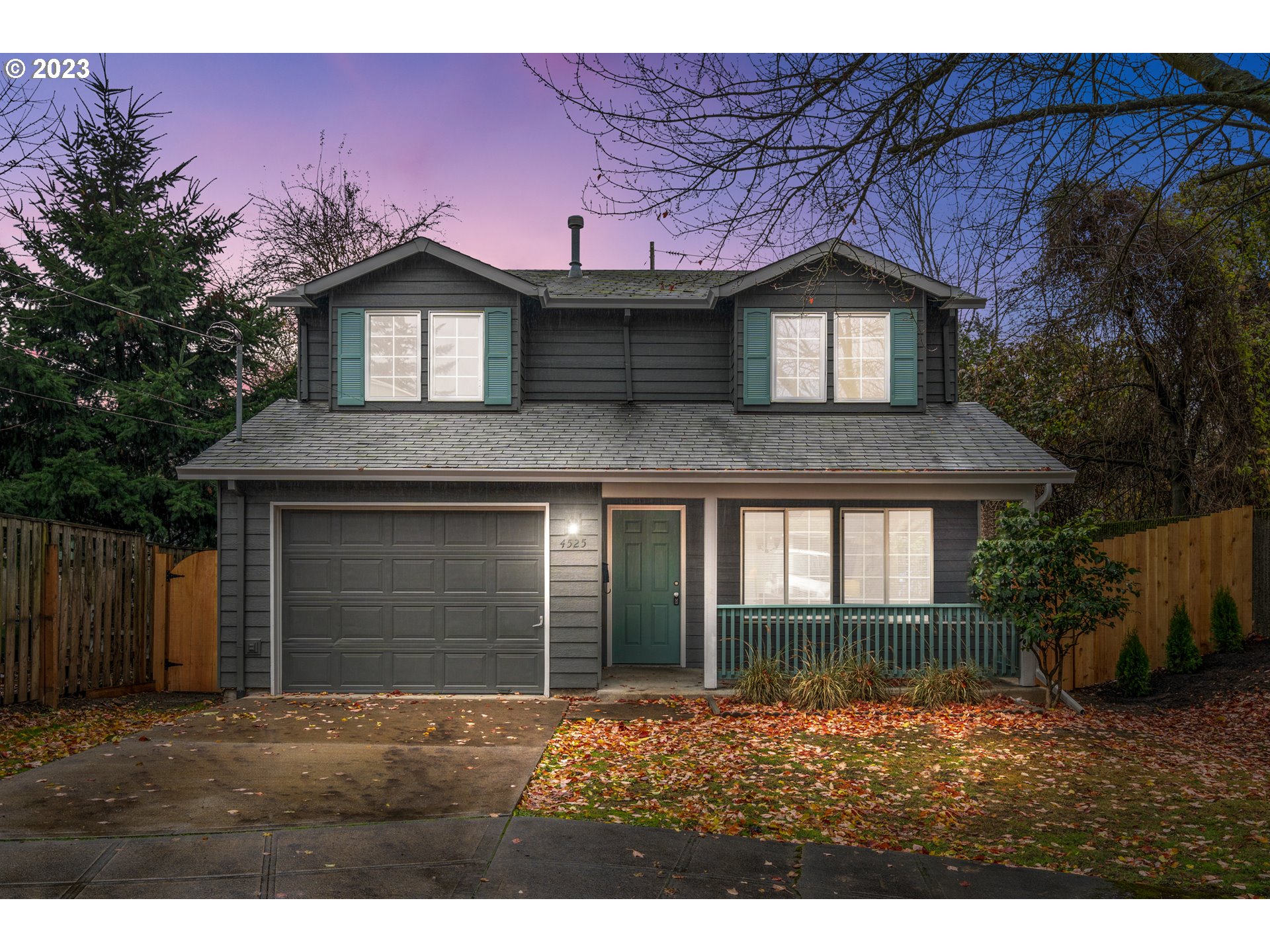 4525 North Colonial Avenue Portland, OR 97217 - Photo 2 of 35 a front view of a house with a yard and garage