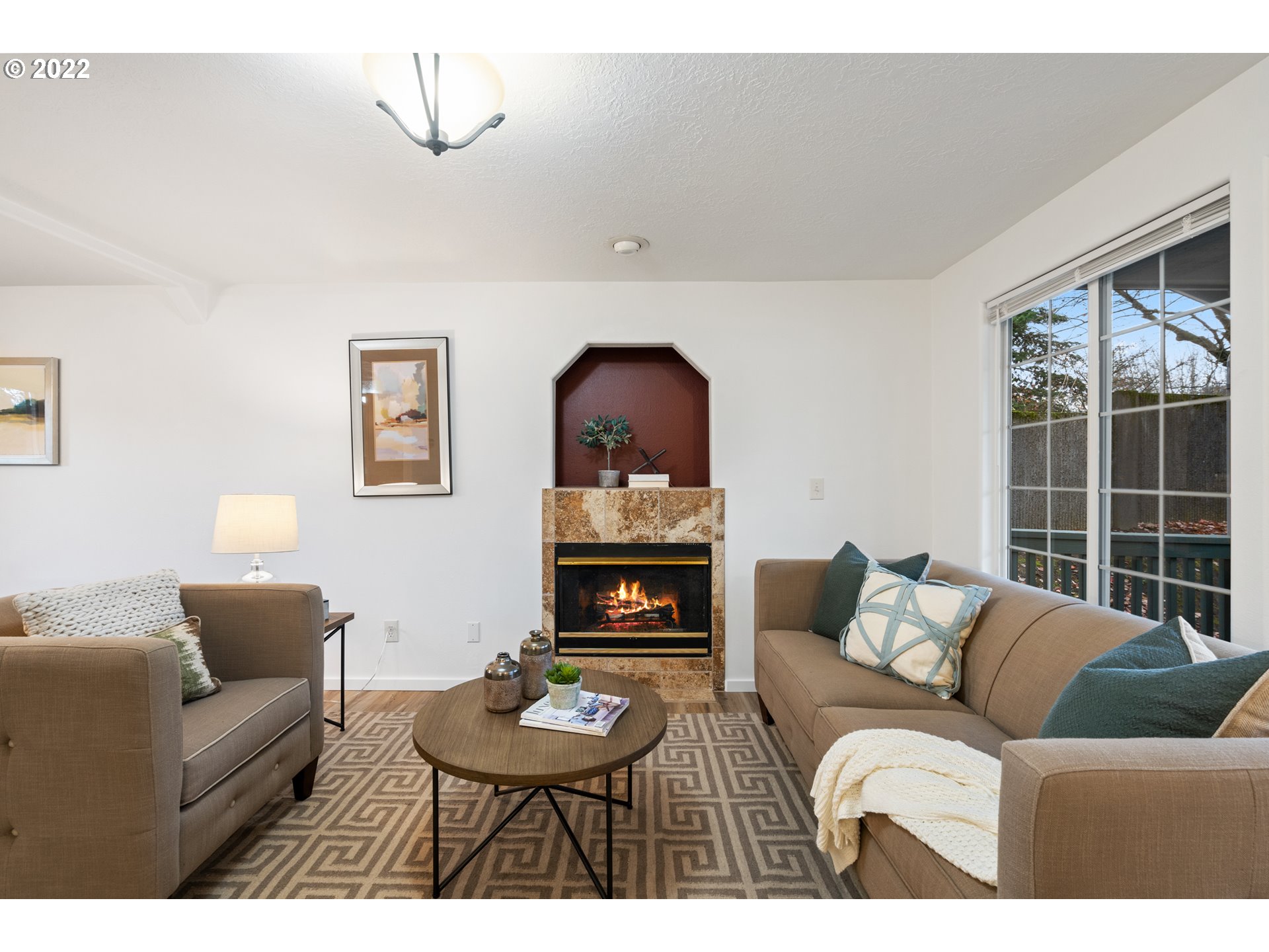 4525 North Colonial Avenue Portland, OR 97217 - Photo 5 of 35 a living room with furniture and a fireplace