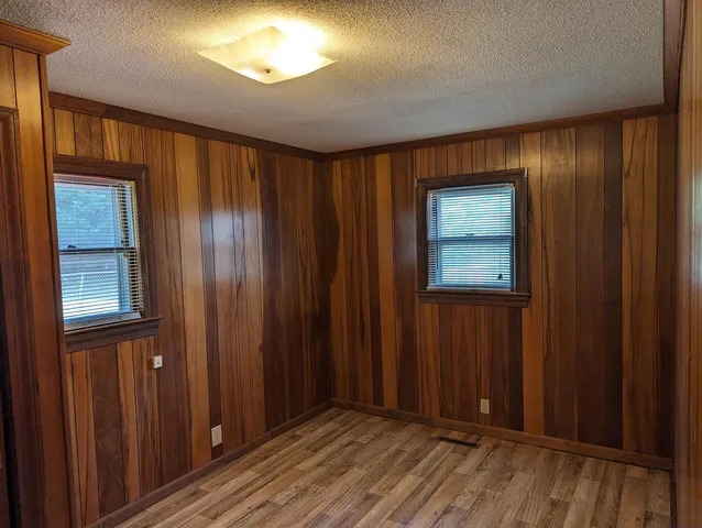 a view of a livingroom with furniture and a window