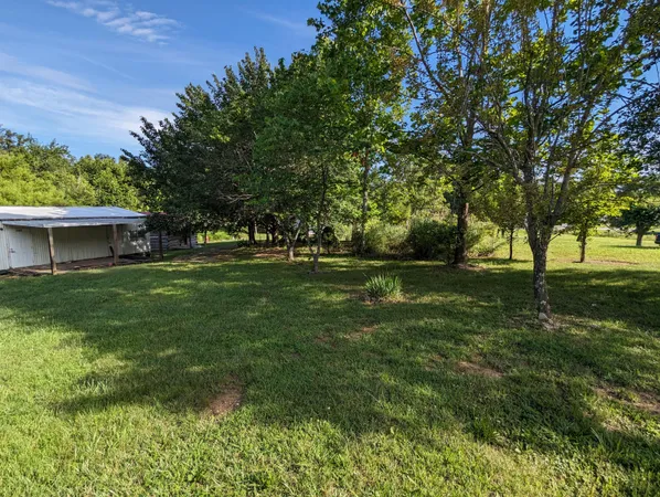 a backyard of a house with seating space