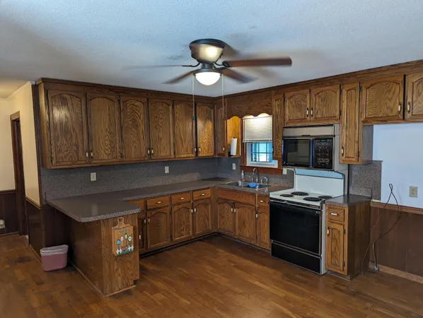 a kitchen with stainless steel appliances granite countertop counter space cabinets and a sink