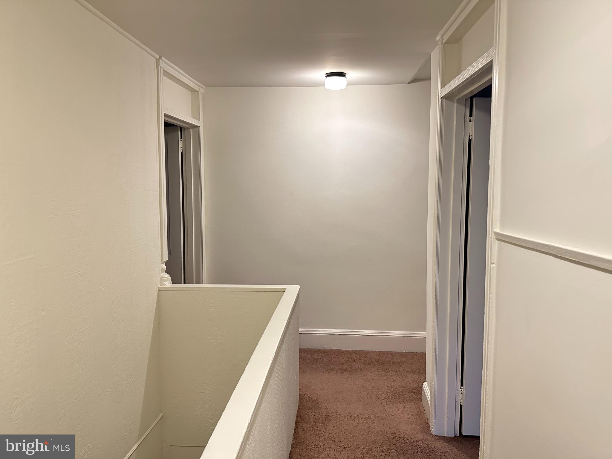 102 School Lane, Unit 4 Wayne, PA 19087 - Photo 3 of 8 Hallway between LR & Bedroom