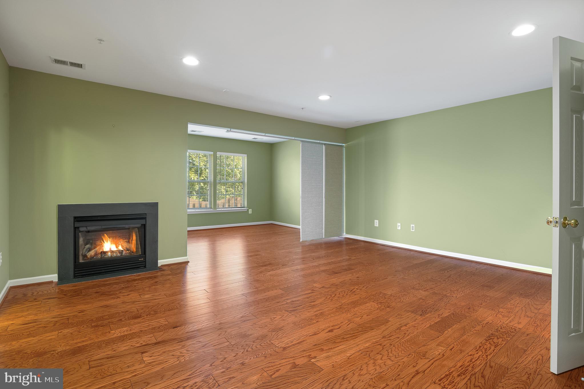 70 Two Rivers Drive Edgewater, MD 21037 - Photo 16 of 69 Spacious room with cozy fireplace.