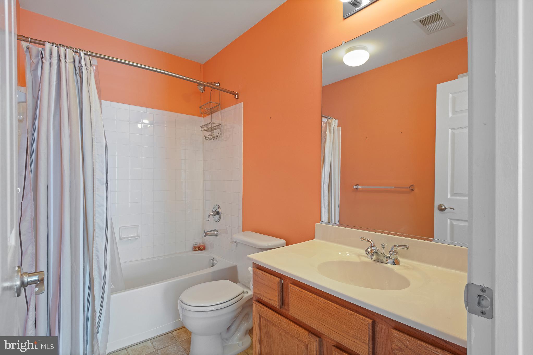 70 Two Rivers Drive Edgewater, MD 21037 - Photo 59 of 69 Vibrant bathroom with modern touches.
