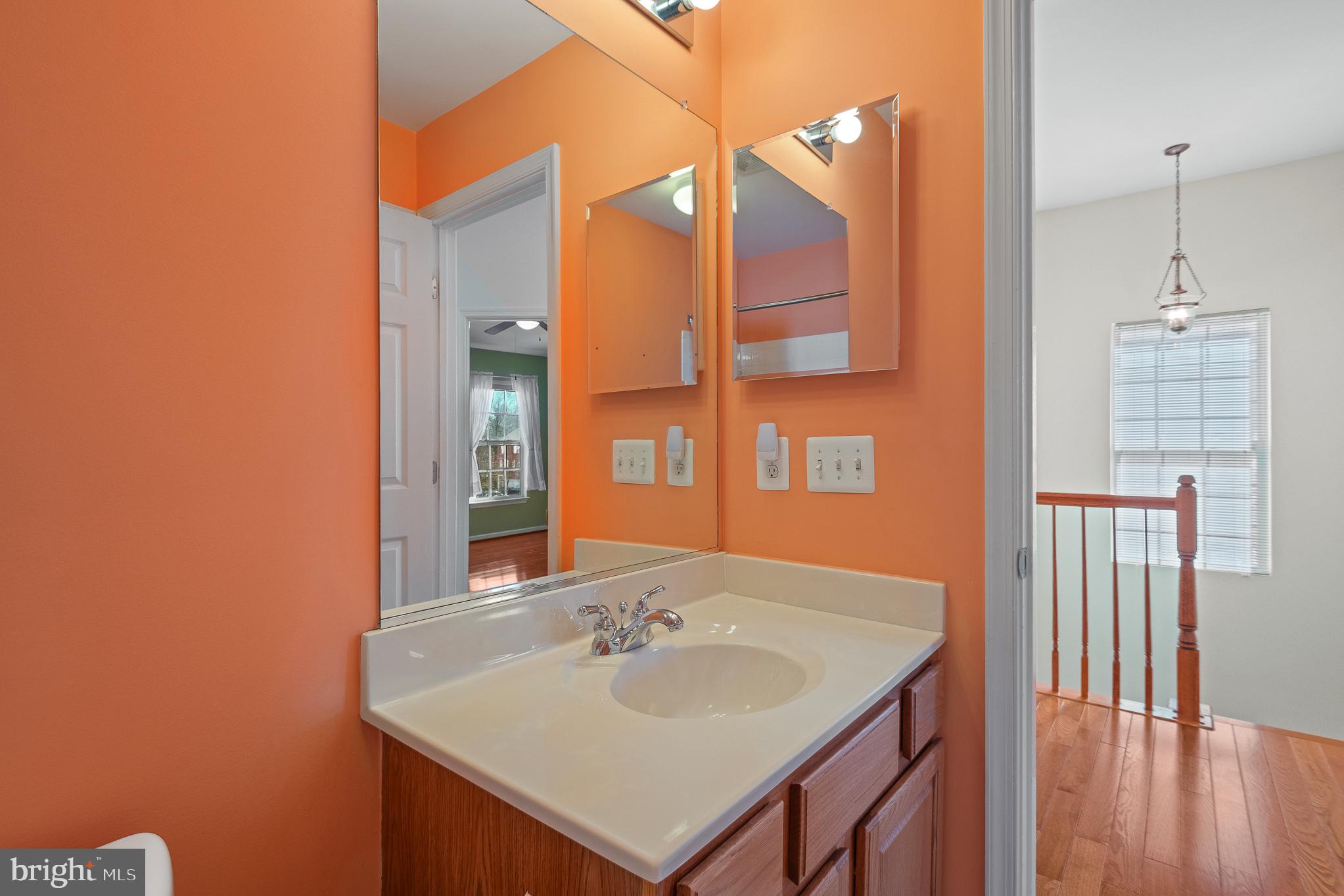 70 Two Rivers Drive Edgewater, MD 21037 - Photo 60 of 69 Vibrant bathroom with modern touches.