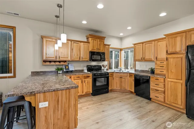 a view of a backyard with wooden fence