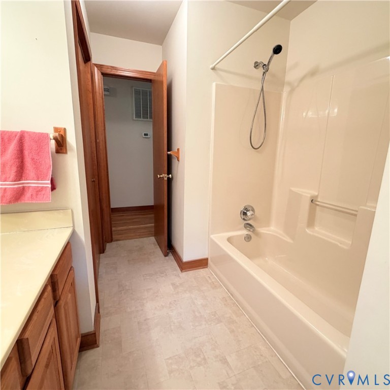 3933 Dunraven Road North Chesterfield, VA 23236 - Photo 25 of 30 a spacious bathroom with a tub sink and mirror