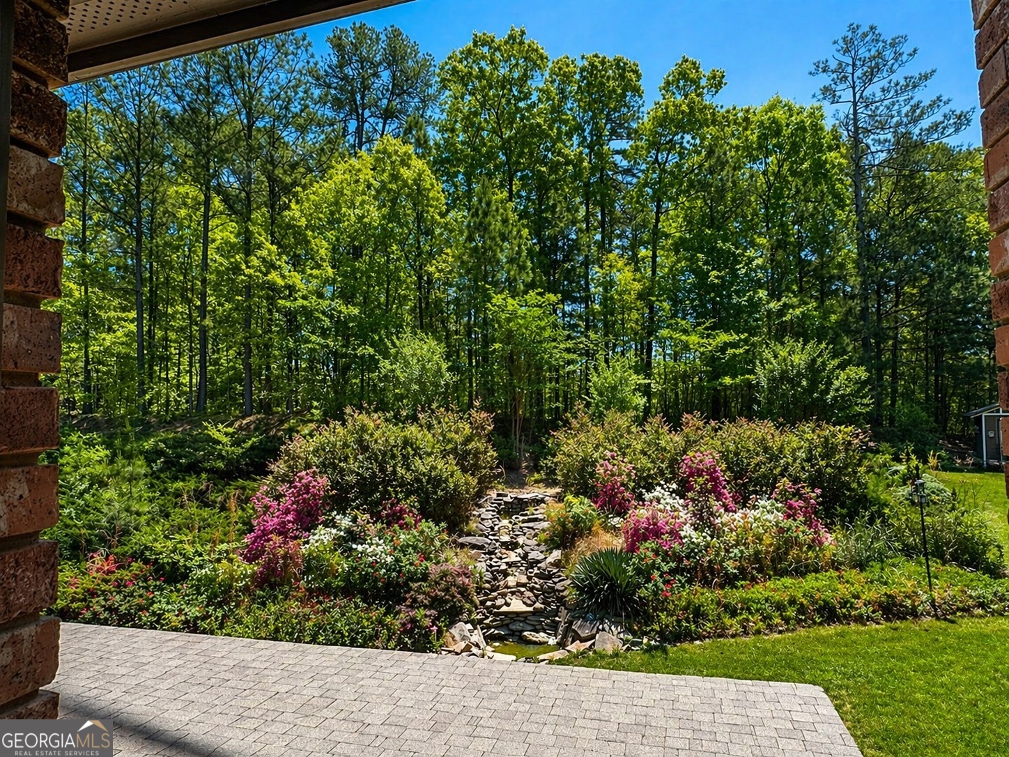 2614 Dolostone Way Dacula, GA 30019 - Photo 4 of 29 a view of a garden with flowers and flowers