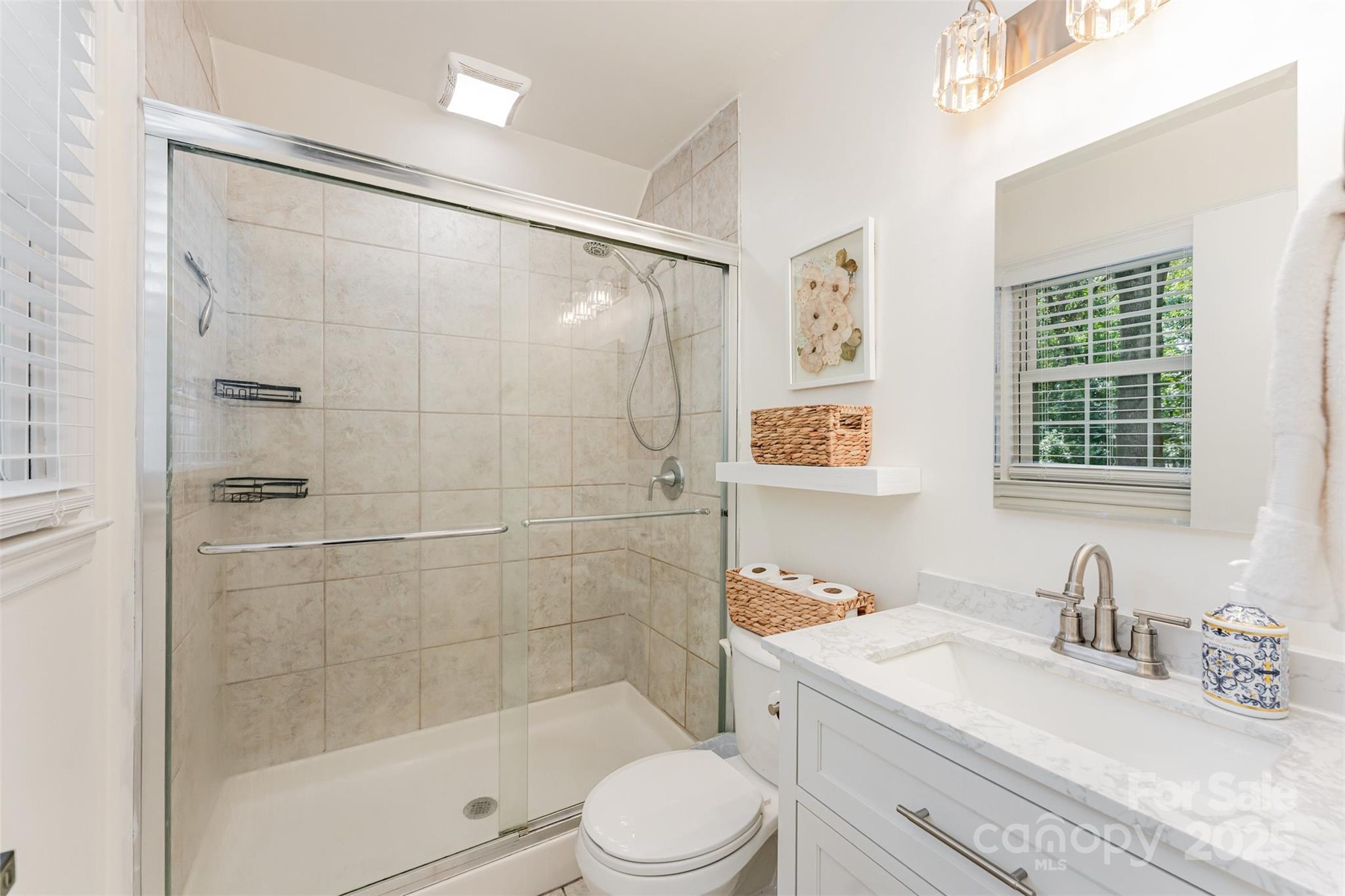 743 Pineborough Road Charlotte, NC 28212 - Photo 11 of 30 a bathroom with a sink toilet and shower