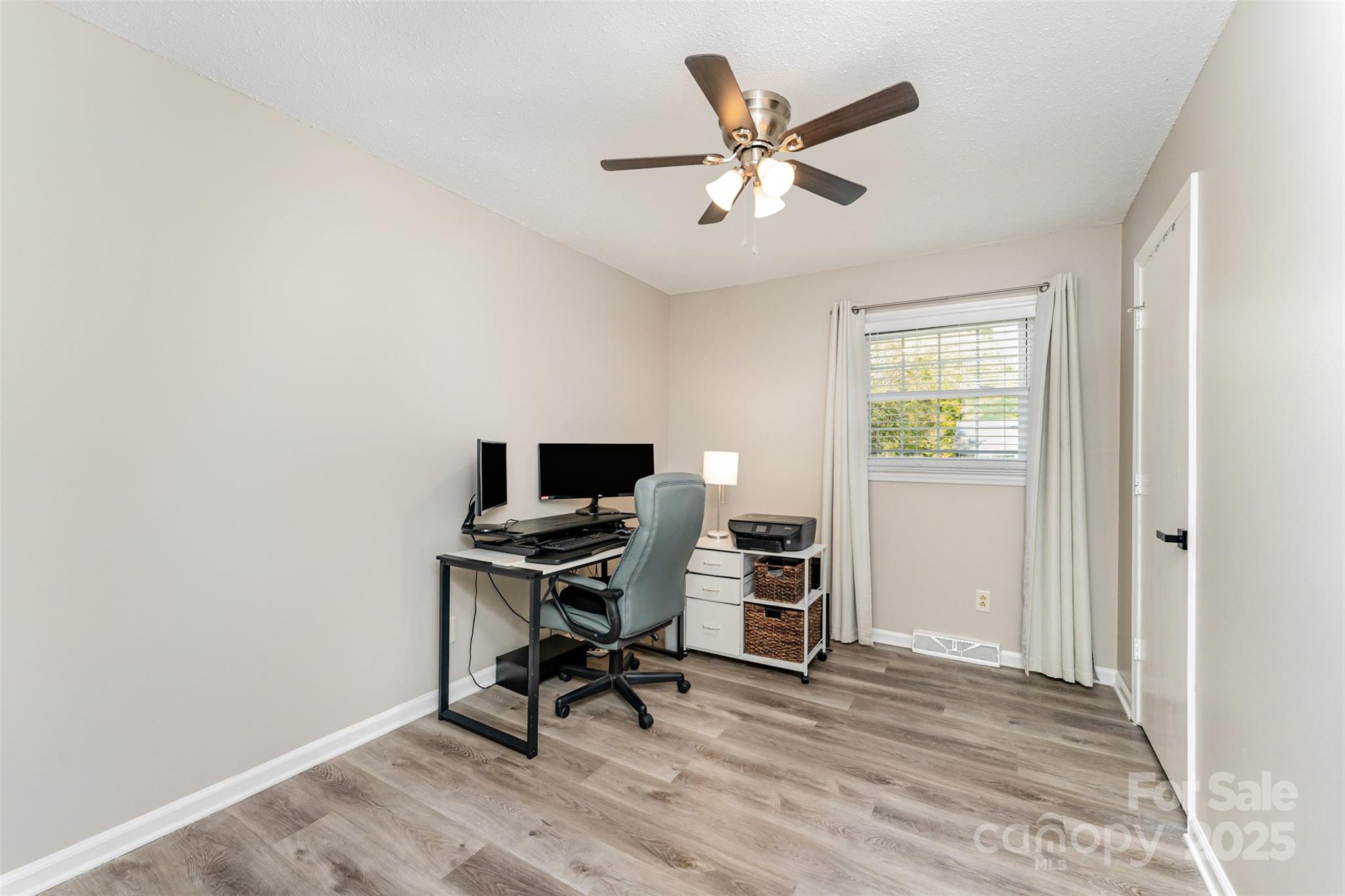 743 Pineborough Road Charlotte, NC 28212 - Photo 12 of 30 a view of a workspace with furniture and a window