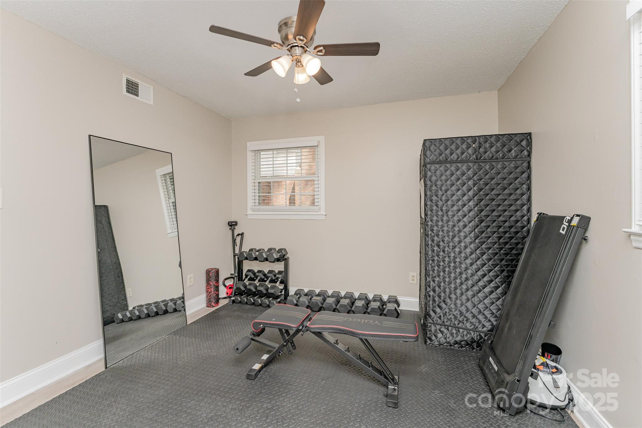 743 Pineborough Road Charlotte, NC 28212 - Photo 21 of 30 a view of a room with gym equipment