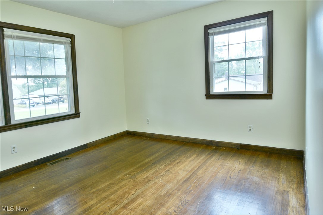 1141 Howell Road East Palestine, OH 44413 - Photo 28 of 41 Spare room featuring hardwood / wood-style floors and baseboards
