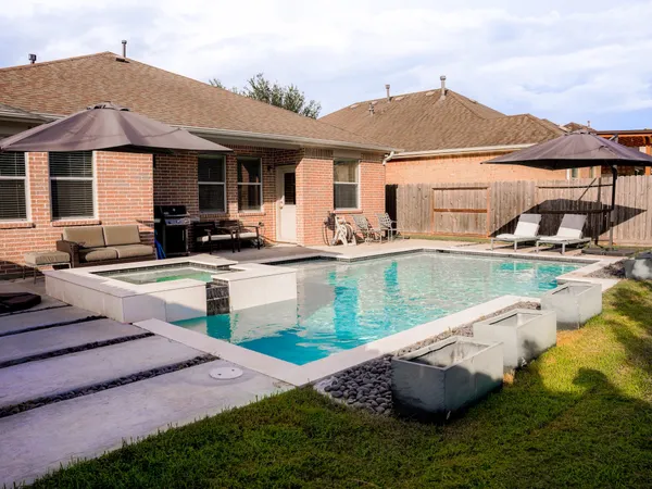 a front view of a house with swimming pool