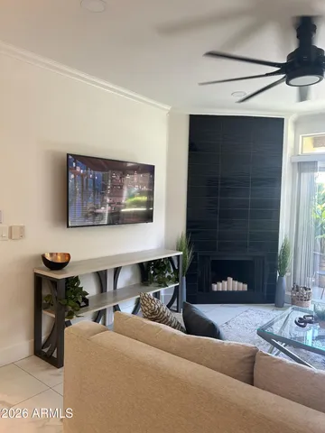 a living room with furniture and a fireplace