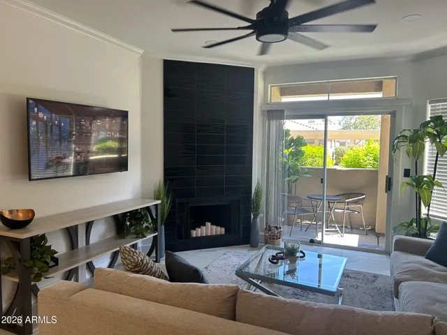 a living room with furniture and a fireplace