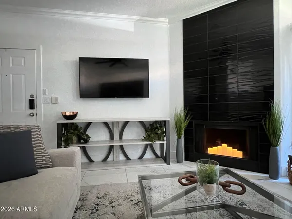 a living room with furniture and a flat screen tv