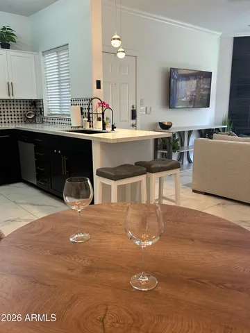 a kitchen with a sink and a stove top oven