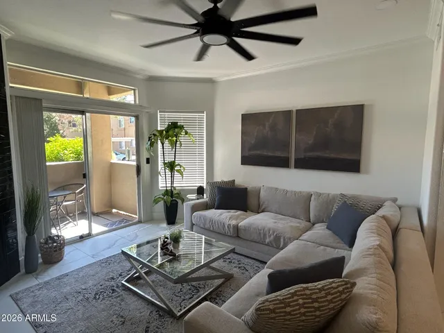a living room with furniture and a window