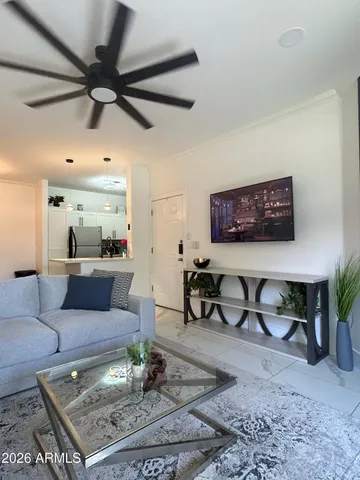 a living room with furniture and a rug