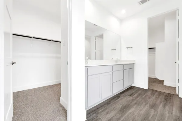 a bathroom with a bathtub and a sink