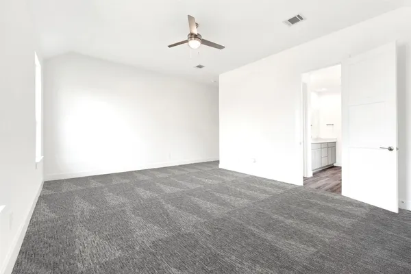 a view of empty room with windows