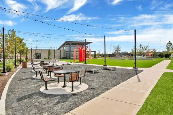 a view of a patio with a table chairs and a patio
