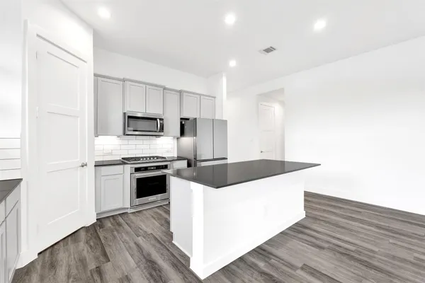 a kitchen with a sink and a window
