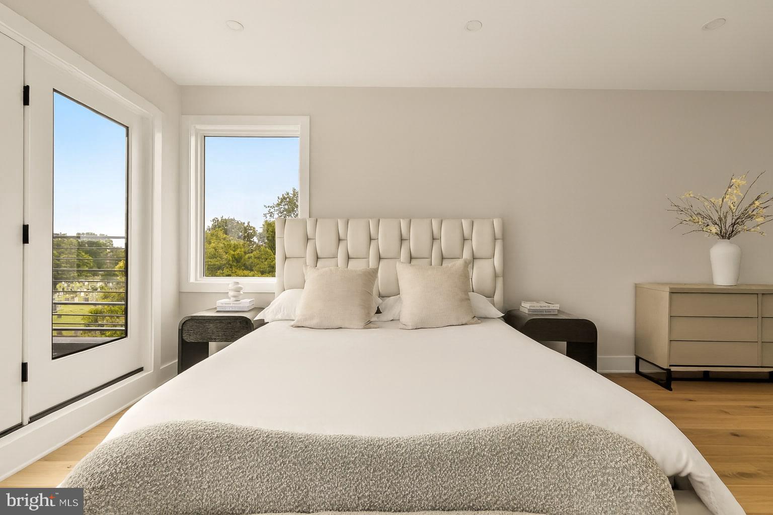 1631 G Street Southeast Washington, DC 20003 - Photo 25 of 42 a bedroom with a large bed and a large window