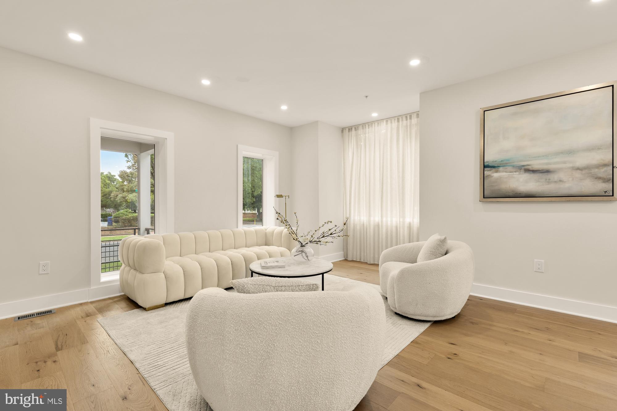 1631 G Street Southeast Washington, DC 20003 - Photo 6 of 42 a living room with furniture and a large window