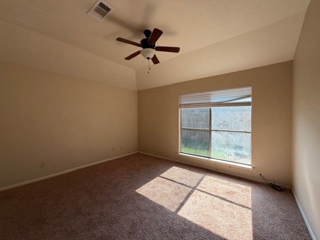 4503 Rattan Avenue Bay City, TX 77414 - Photo 6 of 8 an empty room with windows and fan
