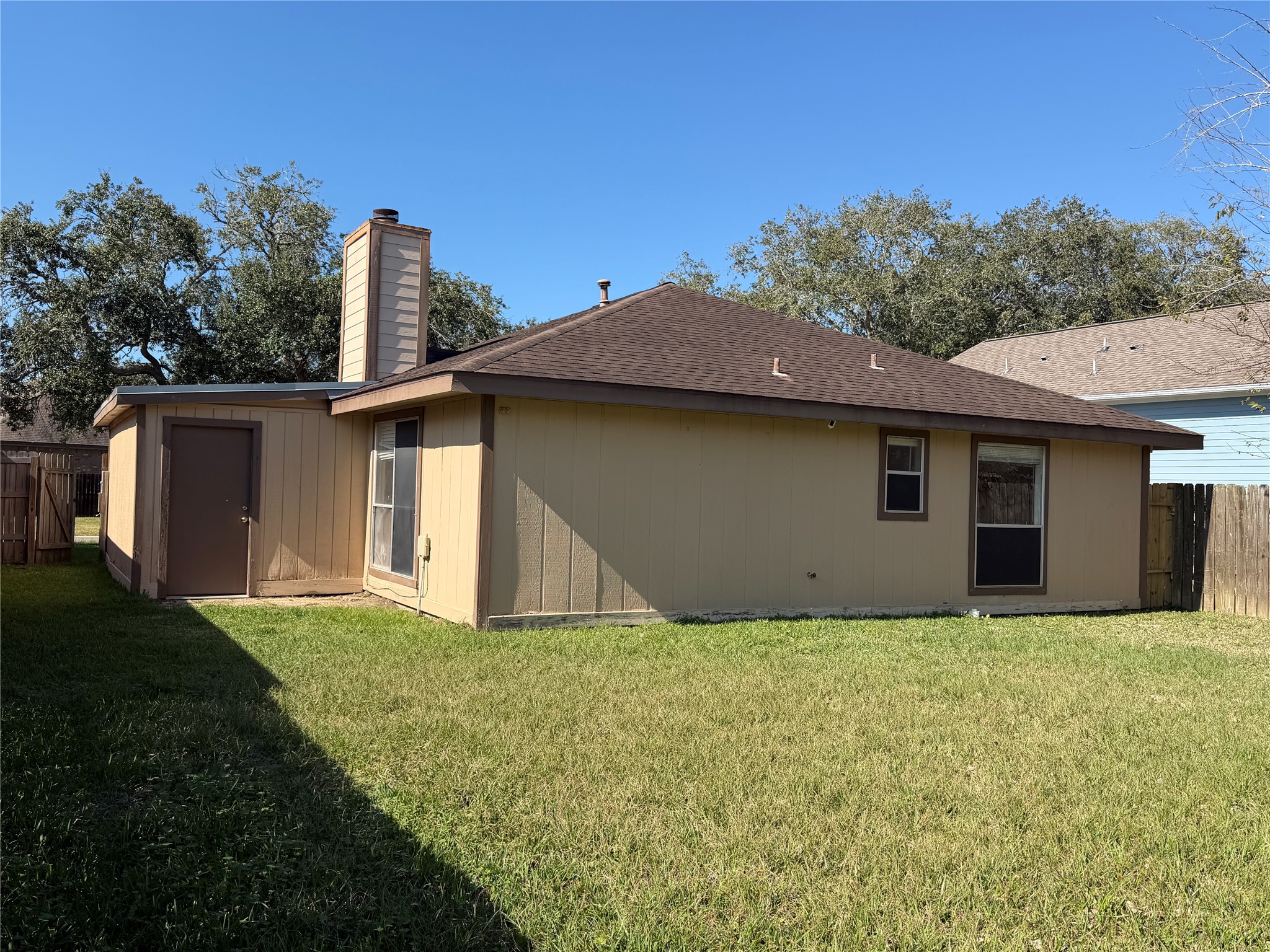 4503 Rattan Avenue Bay City, TX 77414 - Photo 7 of 8 a front view of a house with a garden