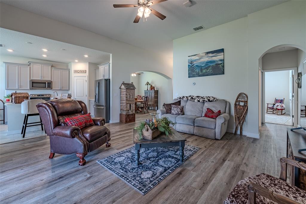 9224 Southwest 60th Ct Road Ocala, FL 34476 - Photo 5 of 55 a living room with furniture and wooden floor