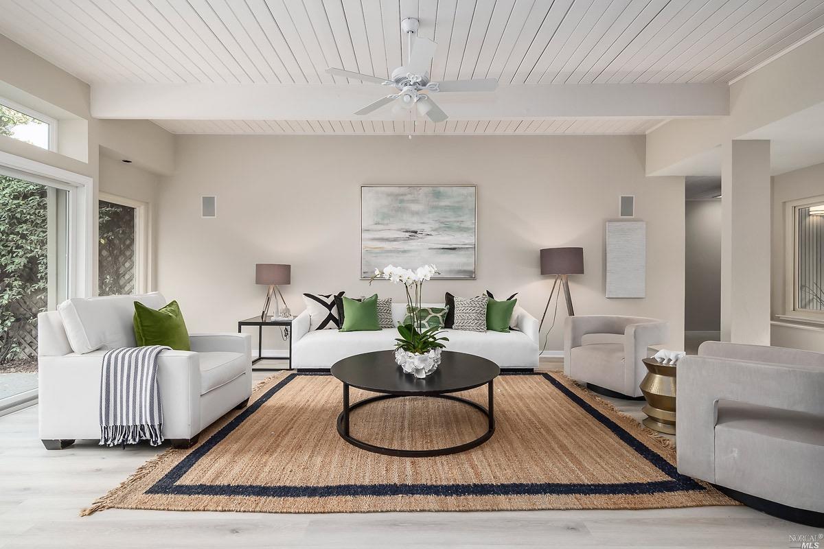 630 Montecillo Road San Rafael, CA 94903 - Photo 1 of 1 a living room with furniture a rug and a chandelier
