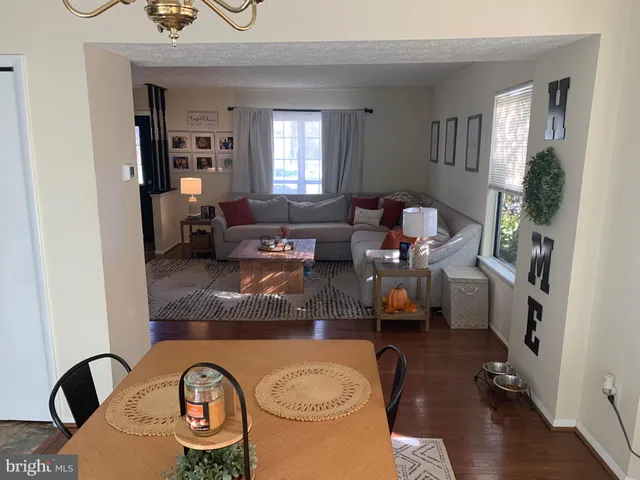 a living room with furniture window and wooden floor