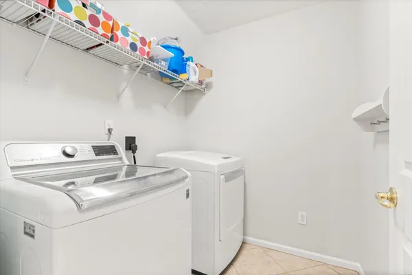 a view of a chair and table under the umbrella