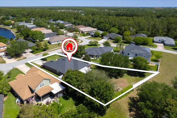 an aerial view of a house with a garden