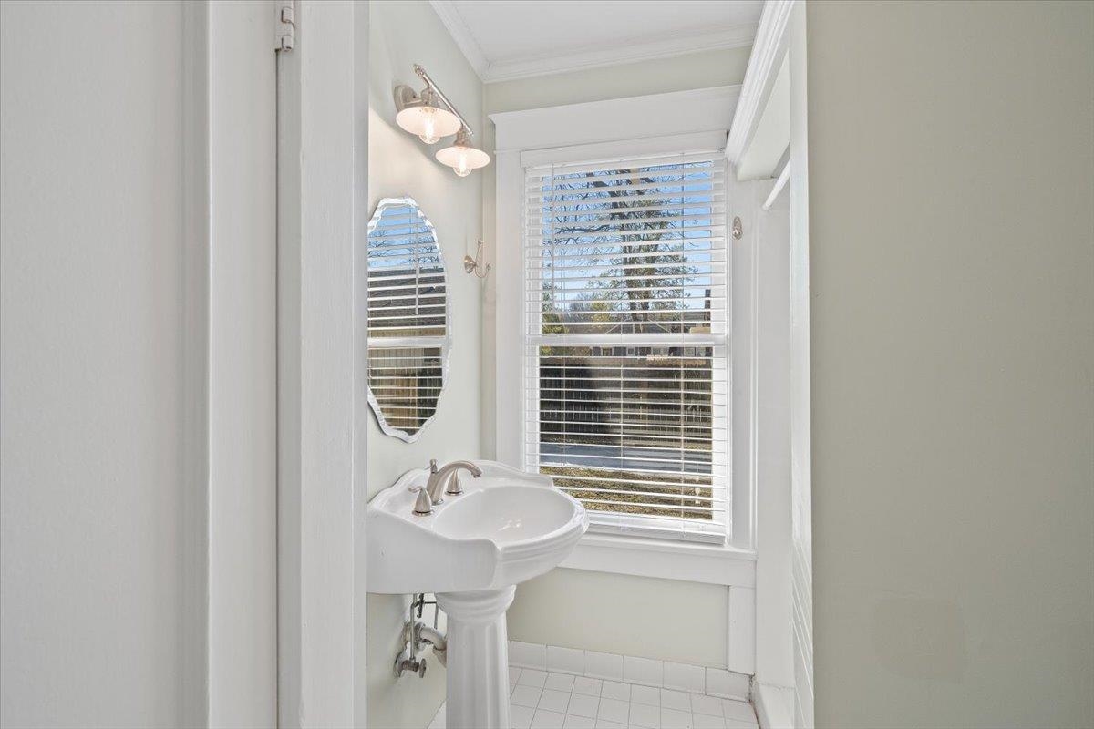 573 Alexander Street Memphis, TN 38111 - Photo 17 of 24 a bathroom with a sink and a mirror