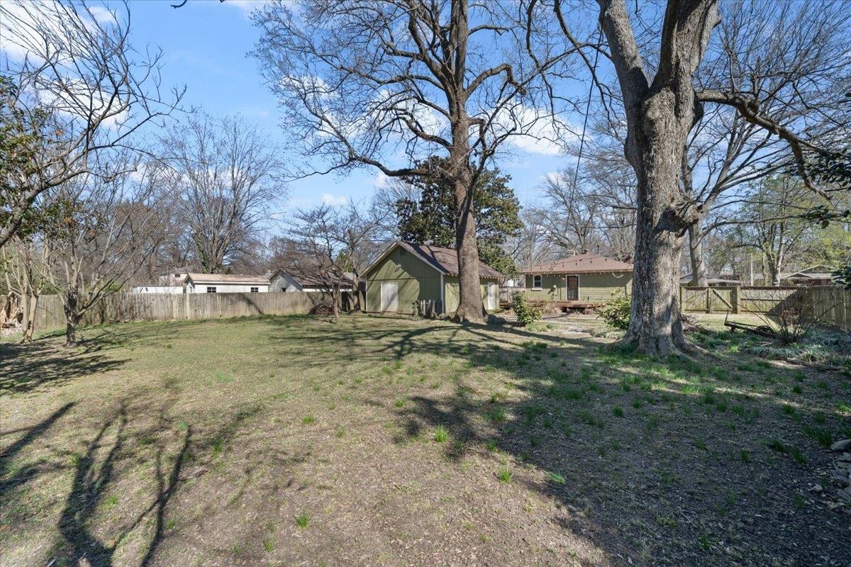 573 Alexander Street Memphis, TN 38111 - Photo 20 of 24 a view of a yard with a large tree