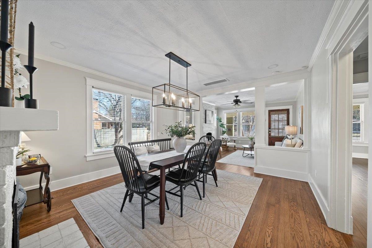 573 Alexander Street Memphis, TN 38111 - Photo 7 of 24 a view of a dining room with furniture window and wooden floor