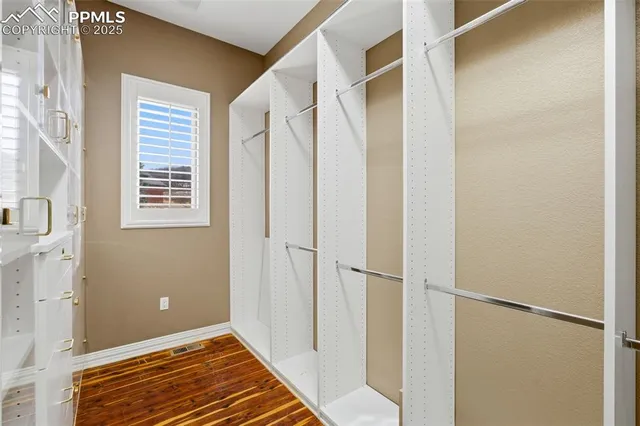 a view of a room with a staircase and a door