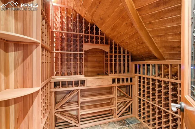 a view of a balcony with wooden floor and fence