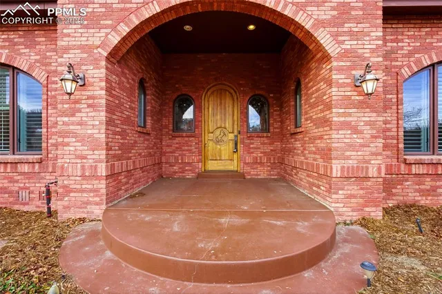 a view of entrance gate of a brick building
