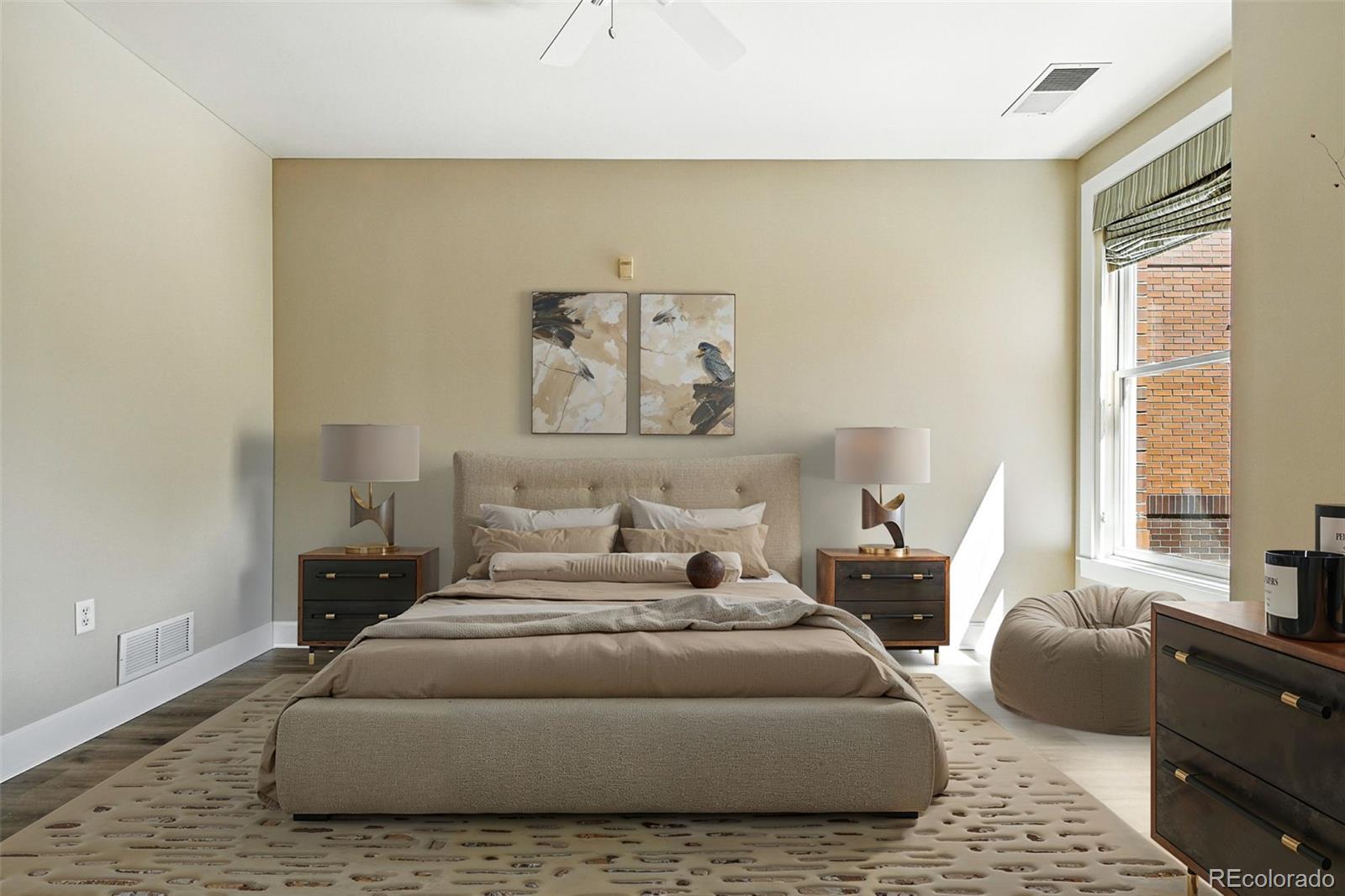 1631 Emerson Street, Unit 207 Denver, CO 80218 - Photo 13 of 30 a bedroom with a bed couch and a large window