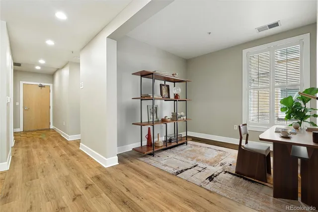 a view of livingroom with hardwood floor and hallway